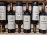 six bottles of wine in a wooden box
