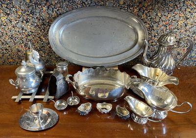 a table with a lot of silver items on it