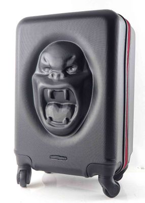 an image of a black suitcase with an angry face on it