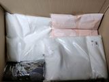 a box with a lot of white shirts inside of it