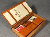 a small wooden box with cards and a watch in it