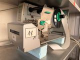 a machine that has a roll of paper on it
