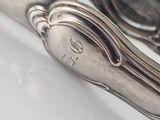 a pair of spoons that are sitting on a table