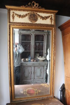 a man taking a picture of himself in the mirror