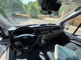 a view of the inside of a car from the driver ' s seat