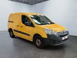 yellow citrole van parked in a large room with a white wall