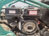 a close up of the engine of a lawn mower