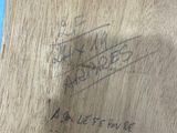 an image of a piece of wood with a piece of writing on it