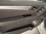 a close up of a car door handle with a speaker in it