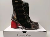 the shoes are in a box on a white surface
