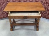 a small wooden table with a drawer underneath it