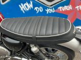 a motorcycle that is parked in front of a wall