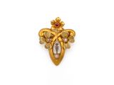une image d'une broche en or et diamants