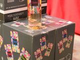 three boxes of liquor are stacked on top of each other