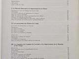 an open book on a table with a number of pages