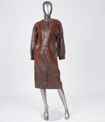 an image of a mannequin wearing a brown leather coat and skirt