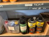 many bottles of cleaner and other cleaning products on the shelf