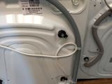 a white washer and a dryer sitting on a pallet