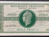 le recto d'un billet de banque français vert et blanc, sur lequel figure le portrait d'un homme