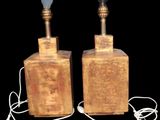 pair of wooden table lamps with lampshads on each of them