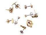 six pairs of gold and silver earrings are arranged in a circle