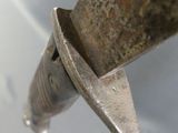 a close up of a metal object with a metal handle