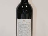 a bottle of wine that is sitting on a table