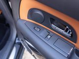 a close up of a car door with a speaker in it