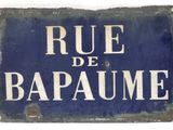 blue and white sign with the words rue de bapaume written on it