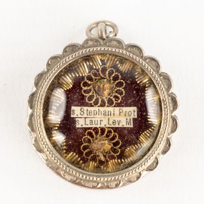 a picture of a pendant with a name on it