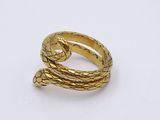 an image of a gold ring with a snake ' s head on it