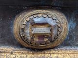 a close up of a metal object with a sign on it