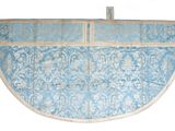 a picture of a blue and white rug hanging on a wall