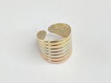 a close up of a gold ring on a white surface