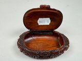 a small wooden box with a label on it