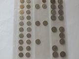 a lot of coins in a plastic bag on a table