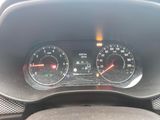 a close up of a car dashboard with a speedometer and gauges
