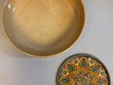 a bowl and a plate sitting on a table