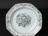 a white plate with a black and white design on it