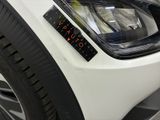 a close up of a car with a sticker on the front of it