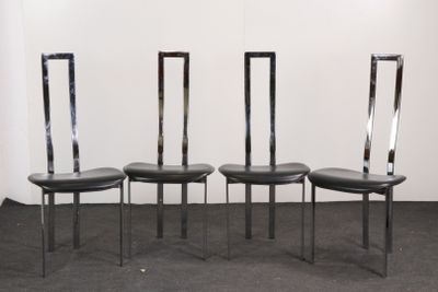 three black leather chairs sitting in a row on a carpeted floor