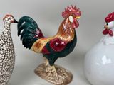 three different types of ceramic figurines sitting on a table