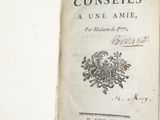 an open book with a picture of a coat of arms on it