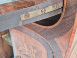 a close up of a wooden desk with a drawer on it
