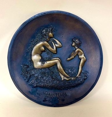 an image of a plaque with a woman and child on it