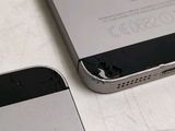 a broken iphone sitting next to a broken iphone
