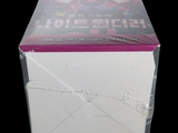 a box with a picture of a girl on it on a black background
