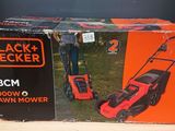 a box of black decker lawn mowers sitting on top of a table