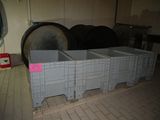 a stack of crates sitting on the floor in a room