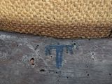 a close up of a piece of wood with a hat on it
